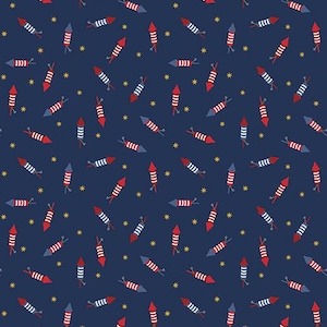 May include: Navy blue fabric with a repeating pattern of red, white, and blue fireworks and small yellow stars. The fireworks are in various orientations, creating a festive design.