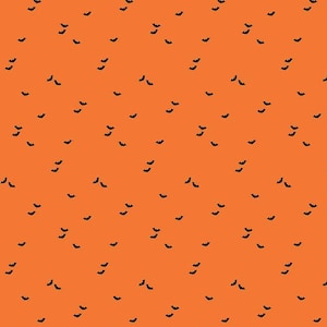 Pode incluir: Tecido laranja com um padrão repetido de morcegos pretos. O tecido tem 12 polegadas de largura e uma régua marcada em polegadas na parte inferior.