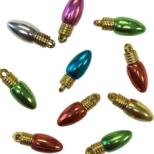 May include: A collection of small, colorful Christmas light bulb ornaments. The bulbs are in various colors, including silver, pink, green, blue, red, and gold. Each bulb has a gold-colored base with a loop for hanging.