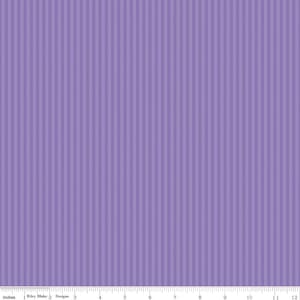 May include: A fabric with a vertical stripe pattern in shades of purple. The fabric has a textured appearance, with the stripes creating a subtle ribbed effect. The image includes a ruler along the bottom edge, with measurements in inches.