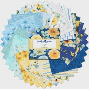 May include: A circular arrangement of fabric squares with floral patterns in shades of blue, yellow, and white. The fabric squares are arranged around a central label that reads "Gentle Meadow". The fabric squares are likely for quilting or other craft projects.