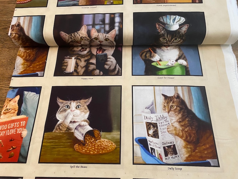 May include: A set of nine fabric squares featuring humorous illustrations of cats in various situations. The illustrations include cats drinking coffee, reading a newspaper, spilling beans, and wearing a chef's hat. The text on the squares includes "Happy Hour", "Spill the Beans", "Guest for Dinner", "Daily Tabby", "RIP Muffy", and "Daily Scoop".