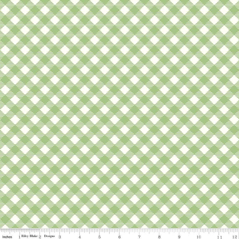 May include: A green and white gingham fabric with a repeating pattern of squares. The fabric is measured in inches.