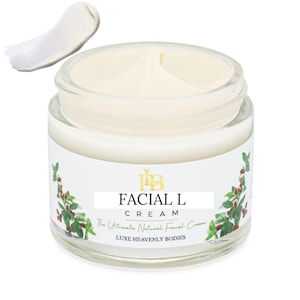 Może przedstawiać: Biały słoik ze złotą pokrywką i etykietą. Etykieta zawiera napis "Facial L Cream The Ultimate Natural Facial Cream Luxe Heavenly Bodies".
