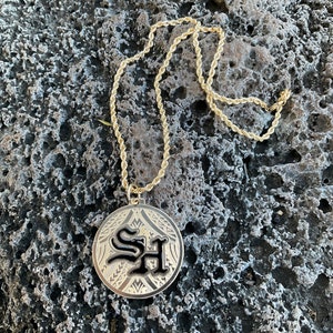 Gold filled large round pendant with initials and tribal design.