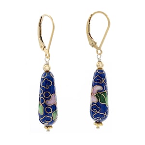 May include: A pair of gold dangle earrings with blue enamel and floral designs. The earrings have a leverback closure.