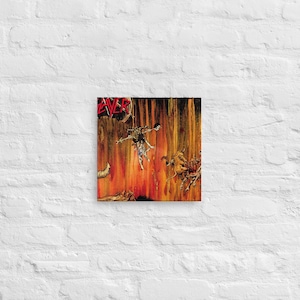 May include: A Slayer album cover with a fiery background and a figure flying through the air. The album title "Reign in Blood" is visible in the top left corner.