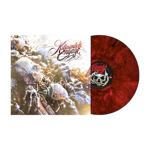 May include: A red and black splatter vinyl record with the band name "Killswitch Engage" and the album title "The Conquering" printed on the label. The album cover features a close-up of a metallic, skeletal figure.