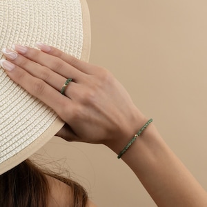 a woman wearing a white hat covering her face