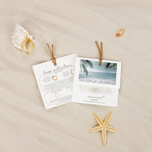 a starfish on the beach next to a couple of photos
