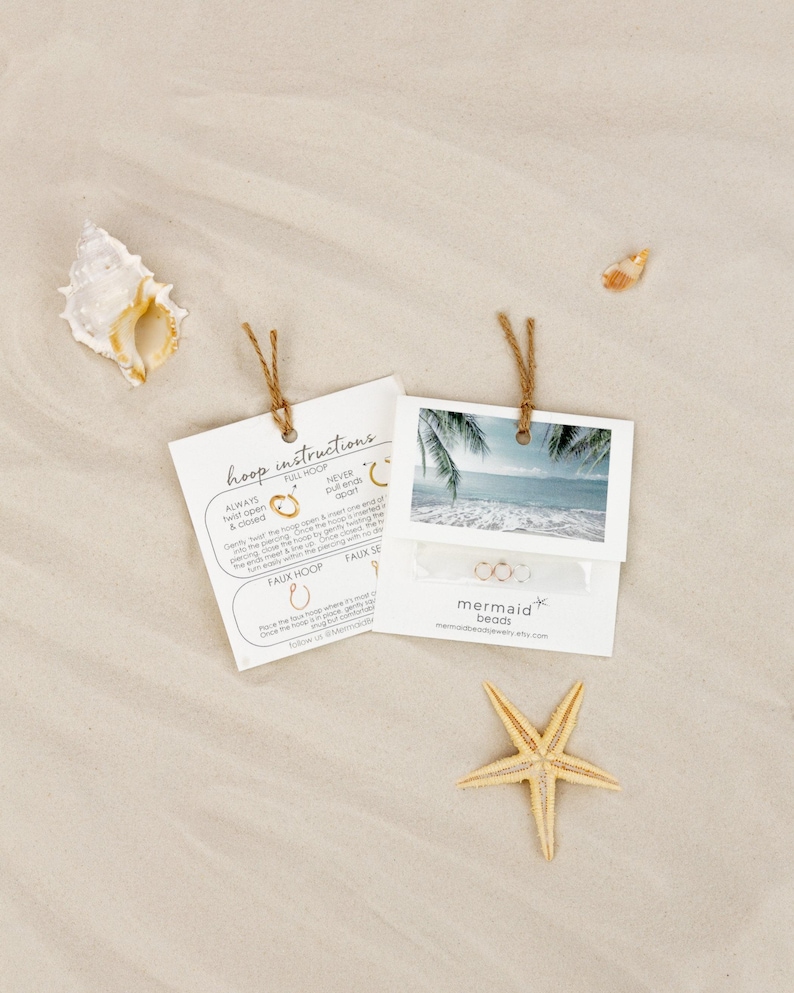 a starfish on the beach next to a couple of photos