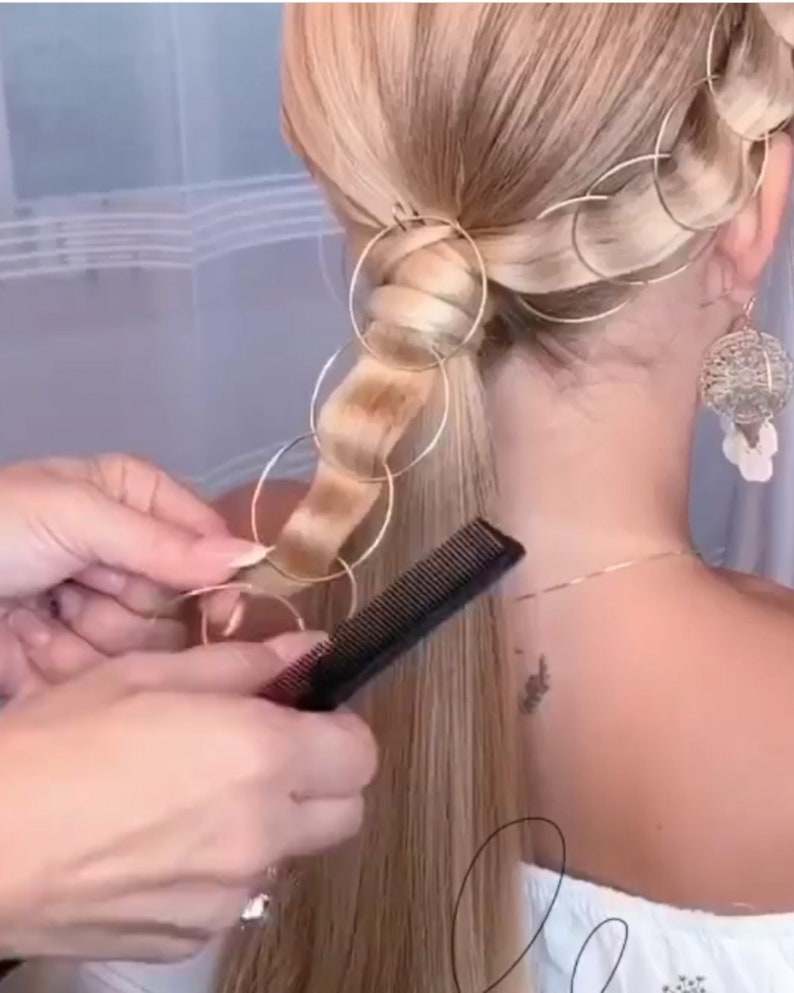 a woman getting her hair done by a hair stylist