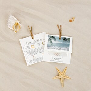 a starfish on the beach next to a couple of photos