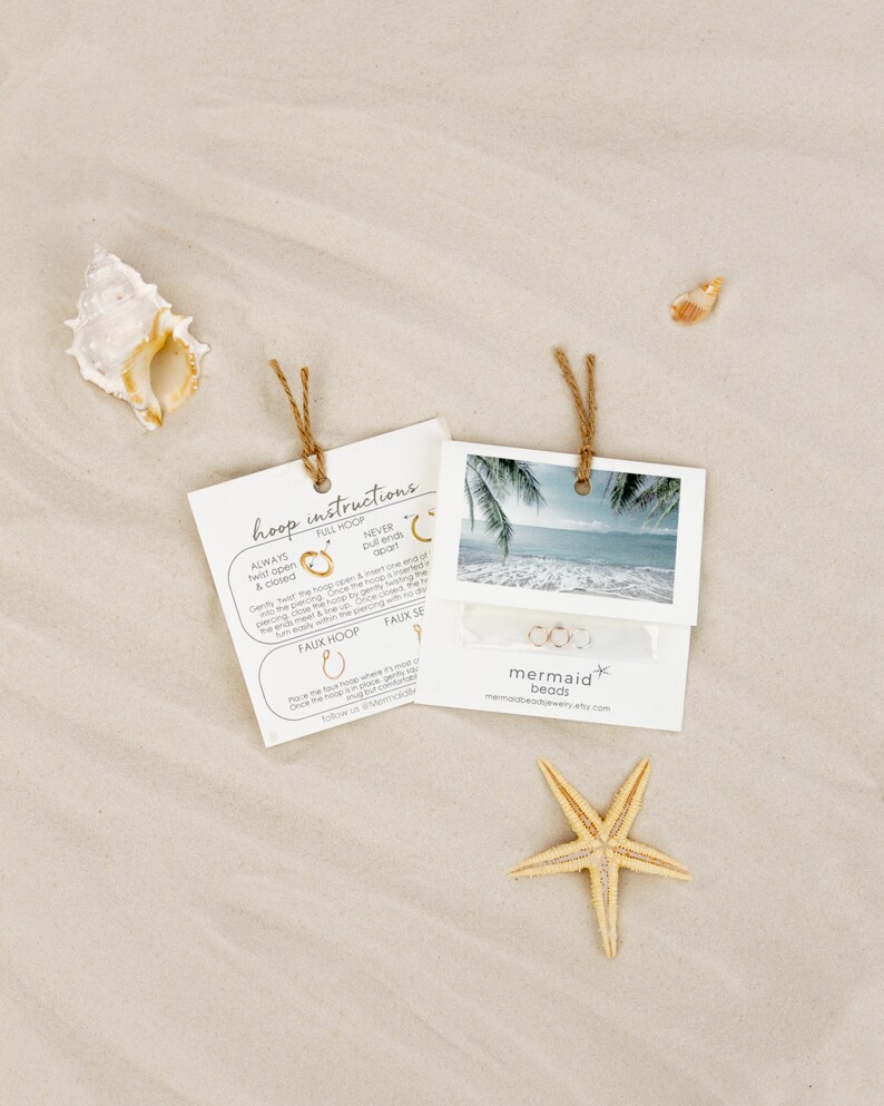 a starfish on the beach next to a couple of photos