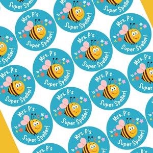 May include: A sheet of blue and white round stickers with a cartoon bee and the text "Mrs. P's Super Speller!"