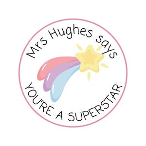 May include: A round sticker with a pink border and the text "Mrs Hughes says YOU'RE A SUPERSTAR". The sticker features a cartoon shooting star with pink, purple, and blue trails and a yellow star.