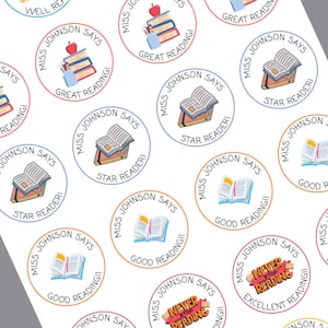 May include: A set of colourful round stickers with a book and text that says "Miss Johnson Says" and various phrases like "Great Reading", "Star Reader", "Good Reading", and "Never Stop Reading".