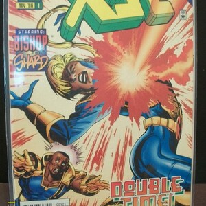 May include: A comic book cover featuring a superhero in a blue and gold costume with a red and yellow background. The title of the comic is "X-SE" and the issue number is 1. The superhero is in a fighting pose and there is a large explosion behind them. The text "Double Time!" is written in large letters at the bottom of the cover.