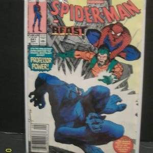May include: Marvel Tales Spider-Man comic book cover featuring Spider-Man in a red and blue suit fighting Beast, a blue furry character with green eyes. The cover also features the text "Marvel Tales Spider-Man Beast" and "Professor Power!"