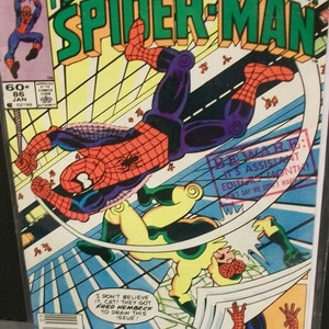 May include: A comic book cover featuring Spider-Man in a red and blue suit swinging through the air. The cover also features the text "Peter Parker the Spectacular Spider-Man" and "Beware: It's Assistant Editors Month!"