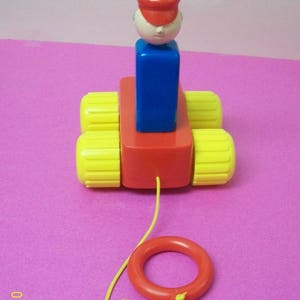 Toddler Pull Toy Train Conductor/Engineer Red  And Blue with Yellow Wheels And Pull String ,  Removable Figure  Not For Under 3 Yrs Old