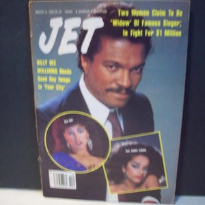 May include: A vintage cover of JET magazine featuring a black and white photo of a man in a suit and tie. The headline reads "Two Women Claim To Be 'Widow' Of Famous Singer; In Fight For £1 Million".