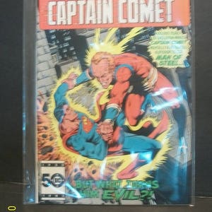 May include: A comic book cover featuring Superman and Captain Comet in a battle. The cover is yellow, red, blue, and green with the text "SUPERMAN & CAPTAIN COMET" in a red box. The text "BUT WHAT TURNS HIM EVIL?" is in a green box.