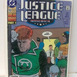 May include: A comic book cover featuring the Justice League of America. The cover art shows a group of superheroes, including Green Lantern, standing in a hospital hallway. The cover text reads "Justice League of America" and "Break Downs Part 1".