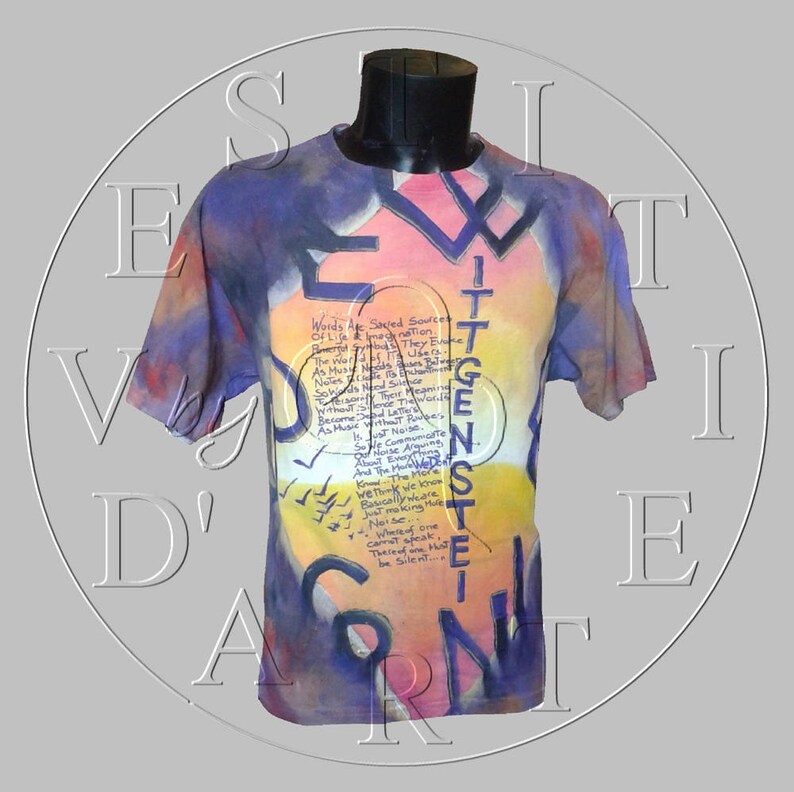 May include: A tie-dye t-shirt with a colorful design and text that reads "Words Are Saved Sources Of Life & Imagination. The World Is What They Become. They Use It As Music. Notes Mean Something. Notes Made The World. So Music Is The Meaning Without Letters. Without Words. Because Without The Words There Is No Music. As So Just Imagine. It Is Not Enough To Just Communicate. So We Can Argue. And The More We Know The More We Must Think We Know. Because We Are Not Making Noise. Just making one. What we speak cannot speak. There must be silence..."