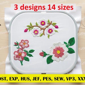 May include: An embroidery hoop with three floral designs in pink, white, and green. The text "3 designs 14 sizes" is at the top. The bottom of the image has the text "DST, EXP, HUS, JEF, PES, SEW, VP3, XXX".