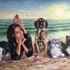 A completed commissioned oil painting on canvas masterfully combining separate photos of a girl, two dogs, and a cat together on a sunny beach. The custom pet artwork blends multiple reference images into one cohesive family portrait.