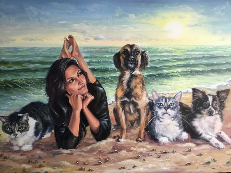A completed commissioned oil painting on canvas masterfully combining separate photos of a girl, two dogs, and a cat together on a sunny beach. The custom pet artwork blends multiple reference images into one cohesive family portrait.