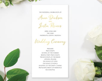 May include: Wedding ceremony program with gold lettering on white paper. The program lists the wedding celebration of Anna Dickson and Justin Raines, the date, location, and the order of events.