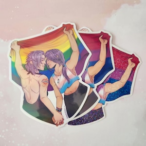 May include: Two people holding rainbow and bisexual pride flags, with the text "Things N' Stuff" on the bottom right corner.