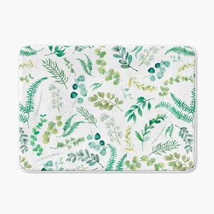 a white background with a repeating pattern of green leaves and ferns.