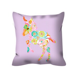 May include: A purple pillow with a colorful zebra print design. The zebra is in a playful pose with its legs in the air.