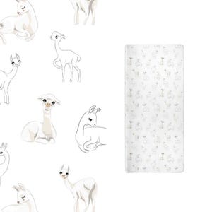 May include: A rectangular changing pad cover featuring a repeating pattern of white and light gray alpacas in various poses, including standing, sitting, and lying down, set against a clean white background with soft, minimalist line art.