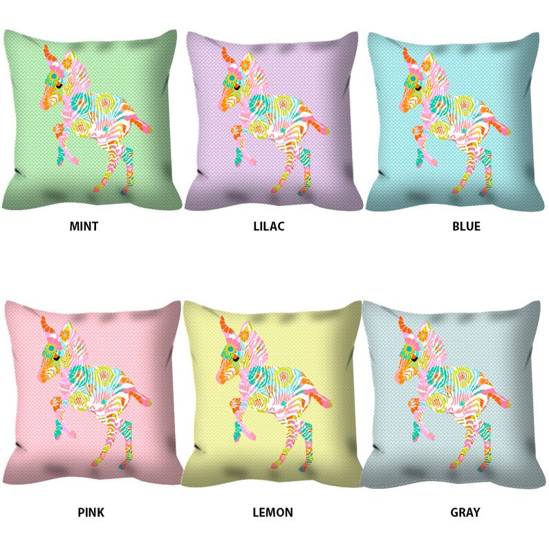 May include: Six decorative pillow covers featuring a colorful zebra foal design on a variety of backgrounds, including mint, lilac, blue, pink, lemon, and gray.