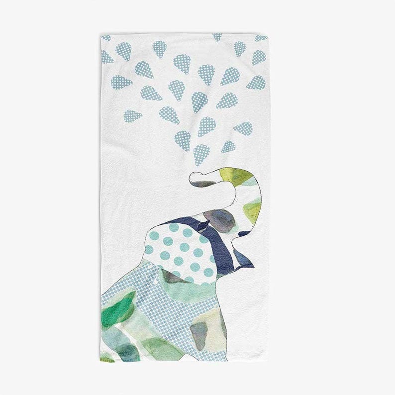 a white towel with a colorful elephant design on it.