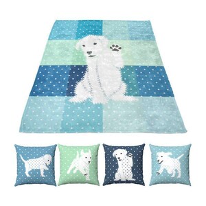 a blue minky blanket with a white dog on it, and there are four matching throw pillows with white dogs on them.