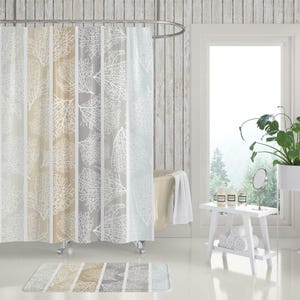 May include: A shower curtain and matching bath mat featuring a vertical striped pattern in shades of beige, gray, and white. The design displays a repeating white skeletal leaf or coral-like botanical print layered over the alternating color panels.