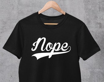 May include: Black t-shirt with a white graphic that says "Nope" in a baseball-style font.