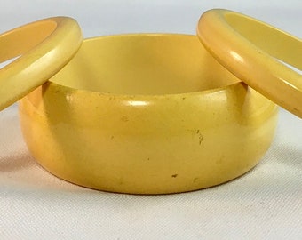 Vintage Pale Yellow Bakelite 1.125" Wide Bangle Bracelet and 2 Pale Yellow .25"+ Wide Bangle Bracelets