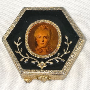 Vintage Estee Lauder Small Hexagonal Goldtone and Black Enamel Compact with an 18th Century Style Portrait on the Lid