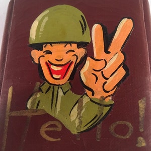Scarce Vintage World War II Brown Leather? Propaganda Compact depicting Stereotypical Image of Japanese Soldier Flashing Victory Sign