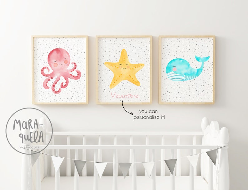 May include: Three watercolor prints featuring a pink octopus, a yellow starfish, and a blue whale. The starfish print has the name "Valentina" written below it.