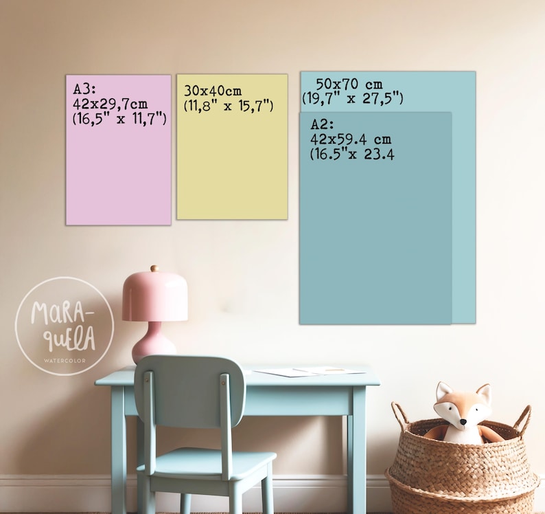 May include: Three rectangular art prints in pastel colors, with size details in inches and centimeters. The prints are displayed above a light blue desk and chair, with a pink lamp and a woven basket containing a stuffed fox. The text "MARA-QUELA WATERCOLOR" is visible.