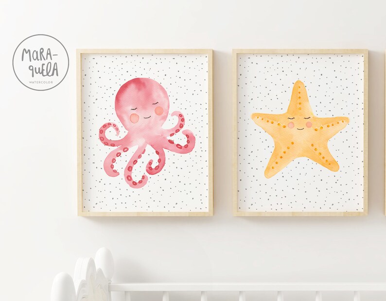 May include: Two framed watercolor illustrations of sea creatures. The first illustration features a pink octopus with a smiling face. The second illustration features a yellow starfish with a smiling face. Both illustrations have a white background with small black dots.