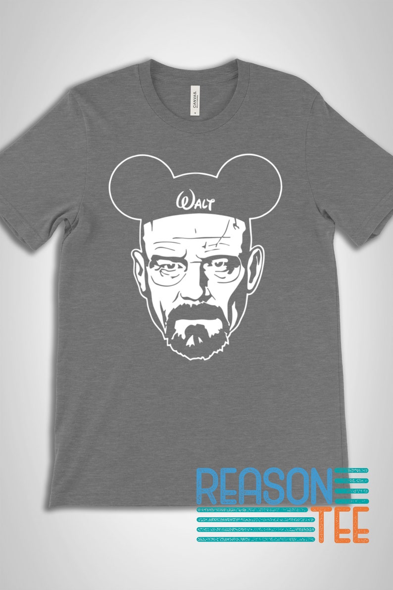 May include: A gray t-shirt with a white graphic of Walter White from the TV show Breaking Bad wearing Mickey Mouse ears. The text "Walt" is written on the ears.