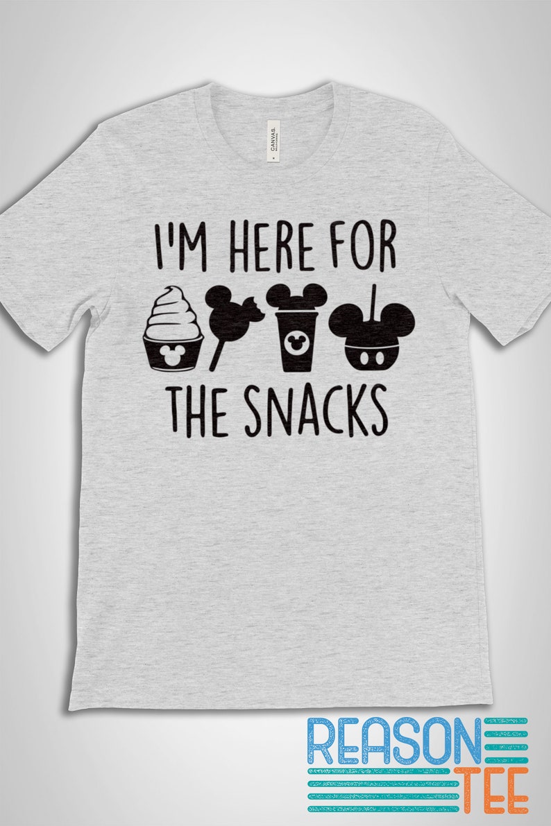 May include: Gray t-shirt with the text "I'm here for the snacks" and a row of black and white Mickey Mouse themed snacks.
